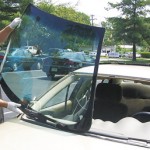 picture of PF Auto Glass Inc performing a windshield replacement in a parking lot